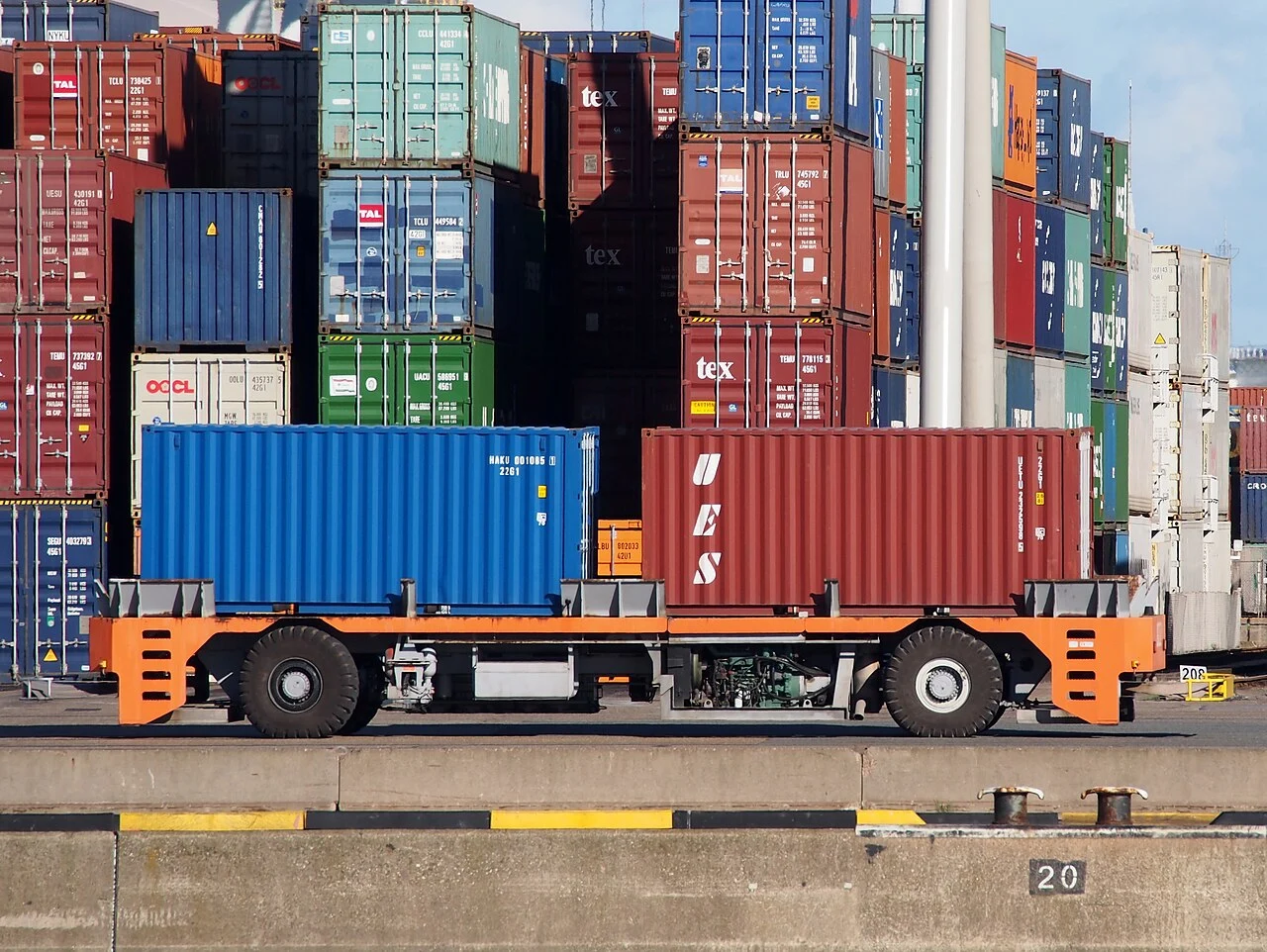 An automated guided vehicle carrying a shipping container