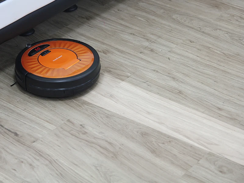 A robotic vacuum cleaner on a floor