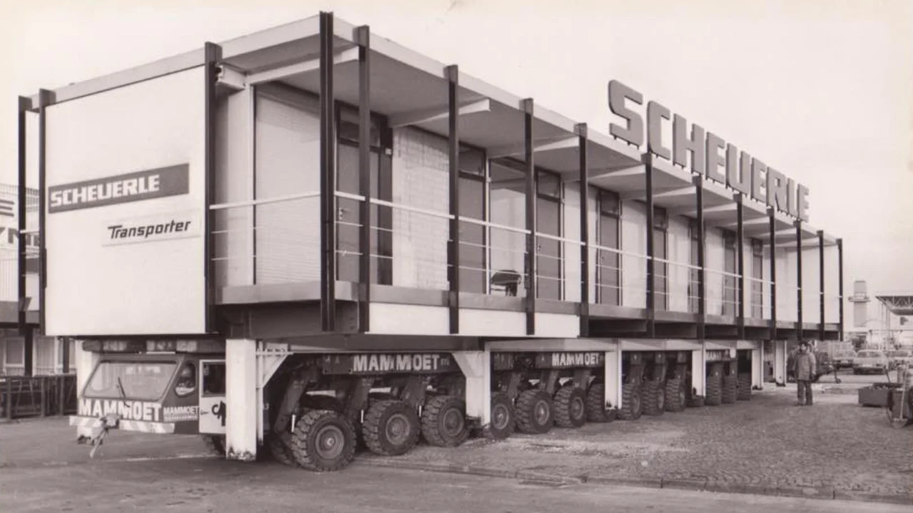 Archive photograph of a Scheuerle modular transporter moving a building