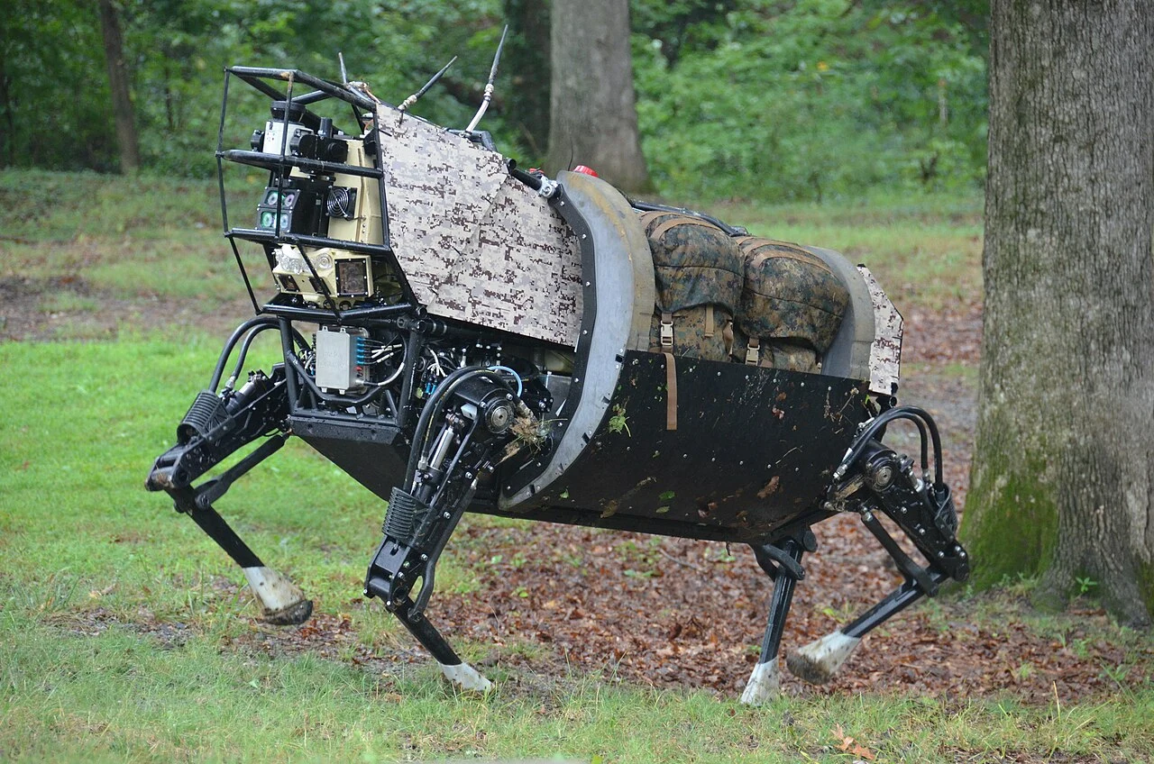 A DARPA LS3 quadruped crossing uneven ground