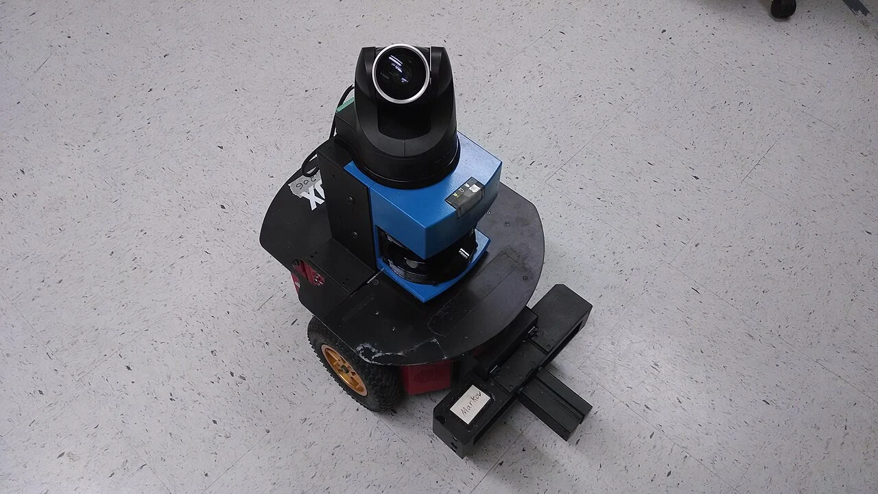 A mobile research robot with a laser scanner, camera and gripper